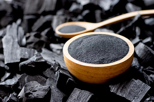 Activated Charcoal is crushed and put into a large cup of charcoal